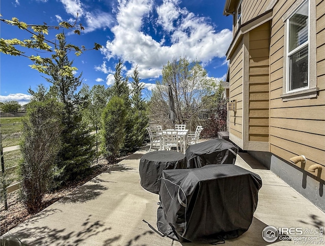 view of patio featuring outdoor dining area and grilling area