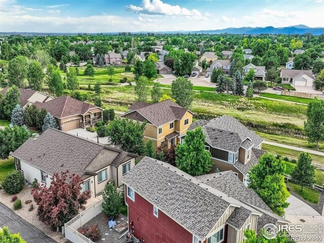 aerial perspective of suburban area featuring a mountainous background