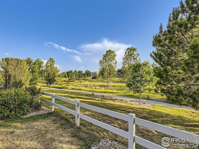view of yard featuring a view of rural / pastoral area