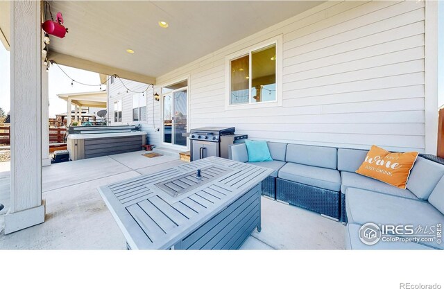 view of patio with a hot tub, outdoor lounge area, and a grill