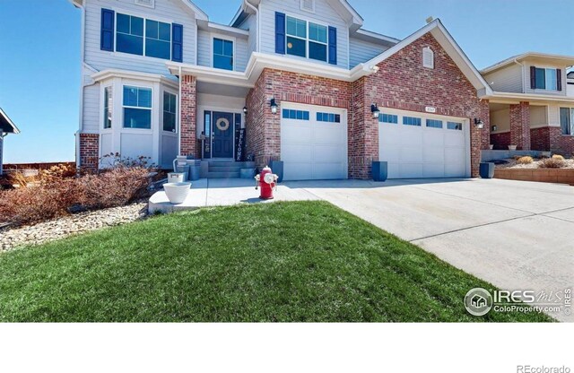 view of front of house featuring brick siding, concrete driveway, and a front lawn