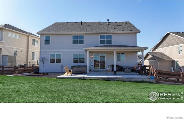 rear view of property featuring a patio area, a hot tub, and outdoor lounge area