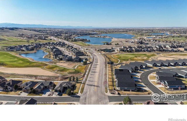 aerial perspective of suburban area with a water and mountain view and a local golf course
