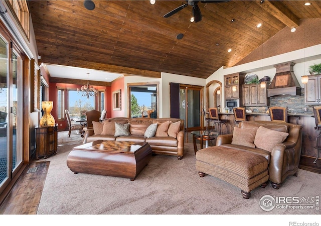 living room with wooden ceiling, beam ceiling, recessed lighting, ceiling fan with notable chandelier, and high vaulted ceiling
