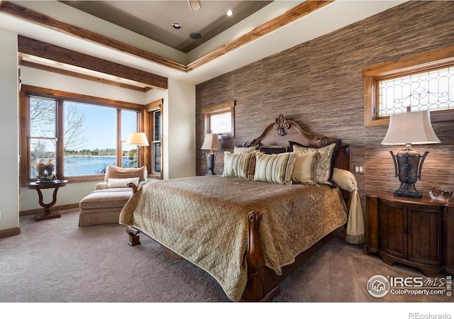 bedroom with a water view, recessed lighting, baseboards, and carpet floors