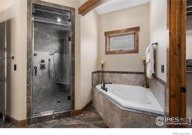 full bath featuring a shower stall, a bath, marble finish floor, and baseboards