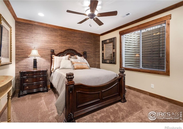 bedroom with carpet, visible vents, baseboards, and ornamental molding