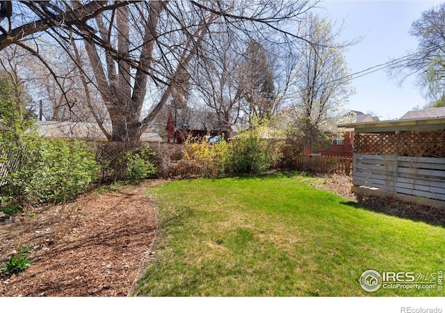 view of yard with fence
