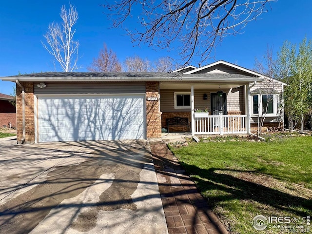 1406 Oak Dr, Berthoud, CO 80513 - ranch-style house featuring a porch, a garage, brick siding, a front lawn, and driveway