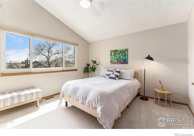 bedroom with carpet, radiator heating unit, vaulted ceiling, visible vents, and baseboards