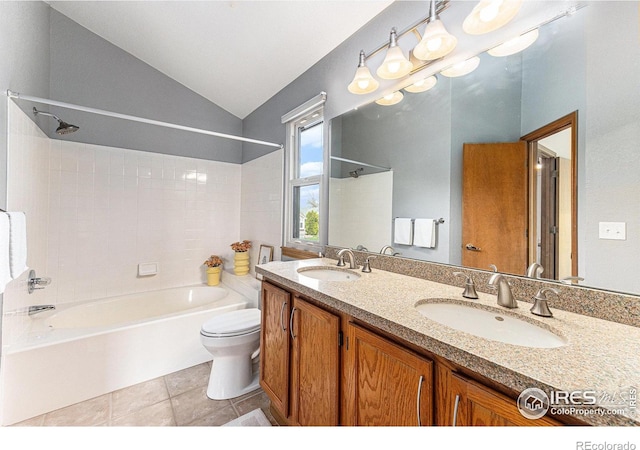 bathroom with toilet, tub / shower combination, a sink, and lofted ceiling