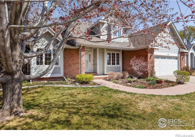 4748 Westbury Dr, Fort Collins, CO 80526 - traditional-style home featuring a garage, driveway, a front lawn, and brick siding