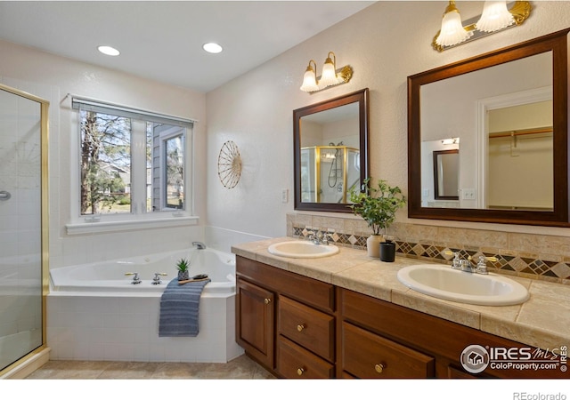 4748 Westbury Dr, Fort Collins, CO 80526 - bathroom with a sink, double vanity, a stall shower, and a garden tub