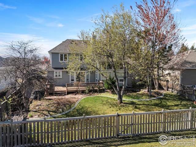 4748 Westbury Dr, Fort Collins, CO 80526 - rear view of house featuring a wooden deck, a lawn, and fence private yard