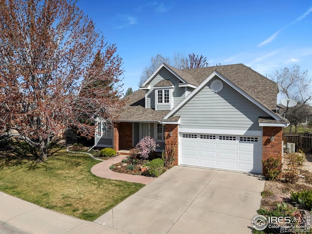 4748 Westbury Dr, Fort Collins, CO 80526 - view of front of house featuring concrete driveway, an attached garage, a front yard, brick siding, and a shingled roof