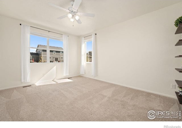 243 Gwyneth Lake Dr, Severance, CO 80550 - empty room featuring baseboards, a ceiling fan, visible vents, and carpet