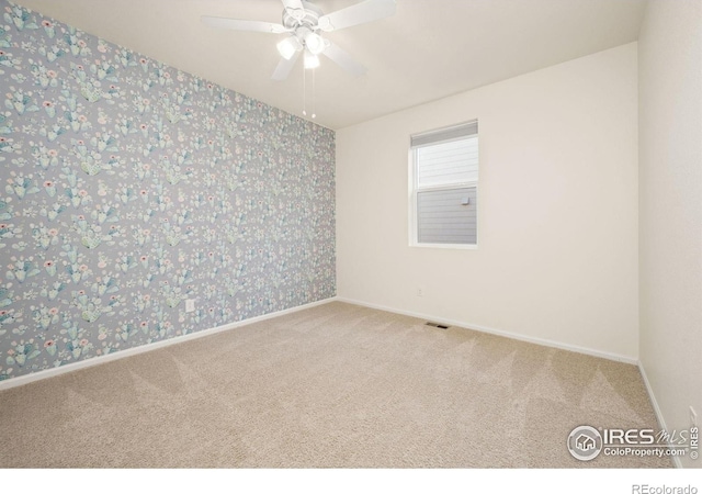 243 Gwyneth Lake Dr, Severance, CO 80550 - unfurnished room with baseboards, carpet flooring, and wallpapered walls