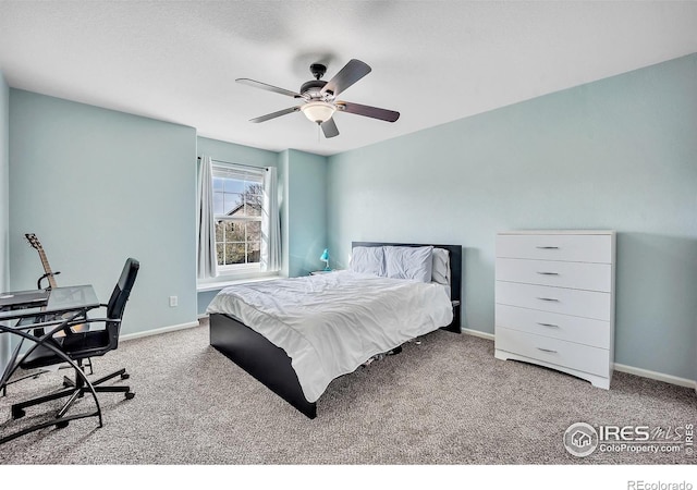 carpeted bedroom with baseboards and a ceiling fan