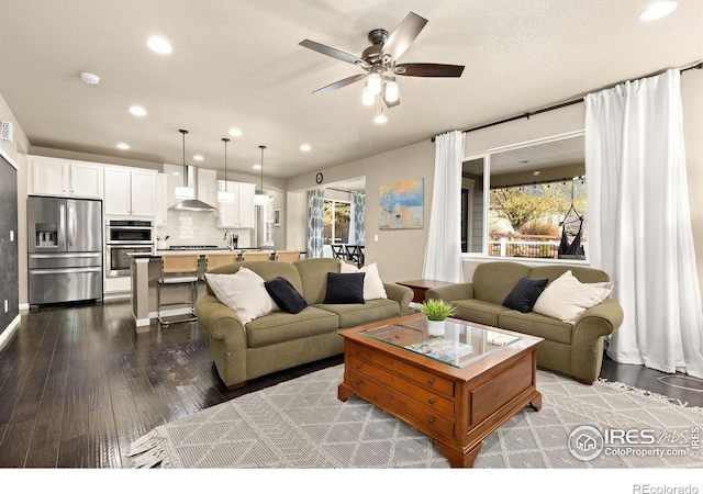 16848 Weber Way, Mead, CO 80542 - living area featuring dark wood-style floors, recessed lighting, and a ceiling fan