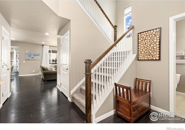 16848 Weber Way, Mead, CO 80542 - stairway featuring wood finished floors, healthy amount of natural light, and recessed lighting