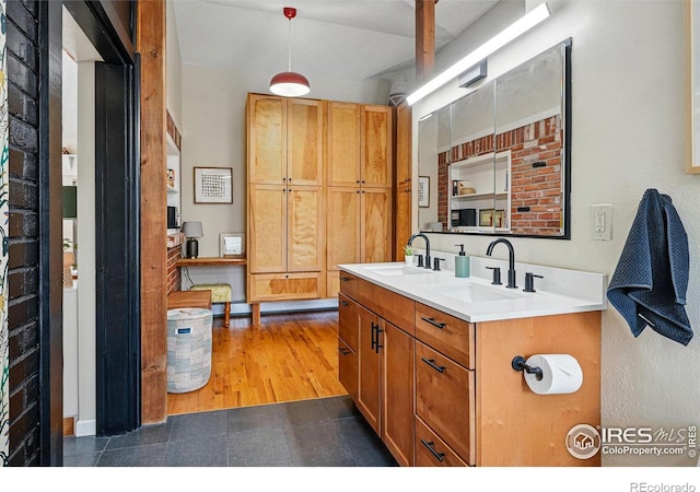 bathroom featuring double vanity and a sink