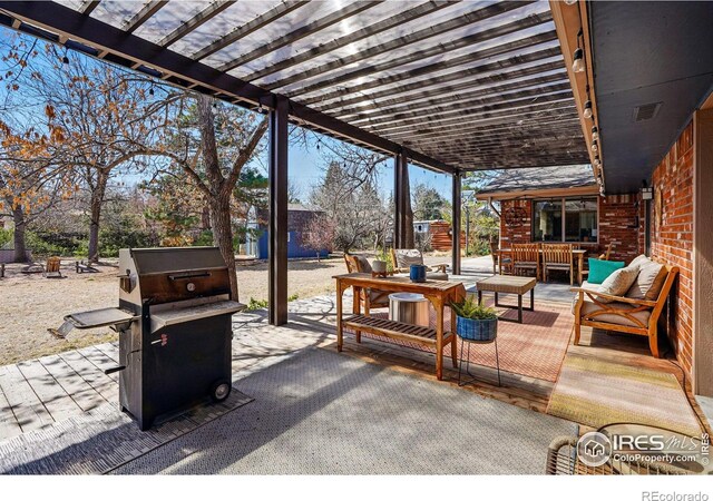 view of patio featuring a pergola, outdoor lounge area, and visible vents