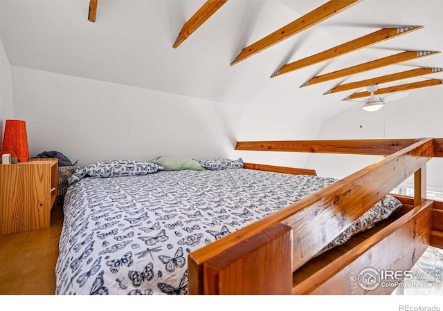 bedroom with lofted ceiling with beams