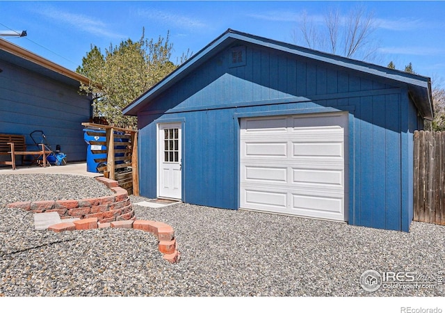 garage featuring fence