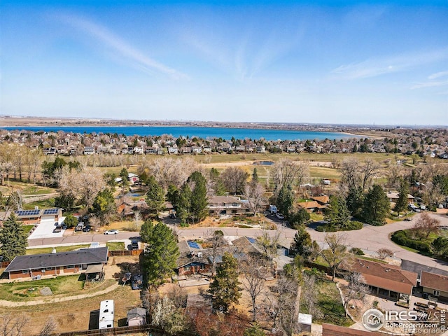birds eye view of property featuring a residential view and a water view