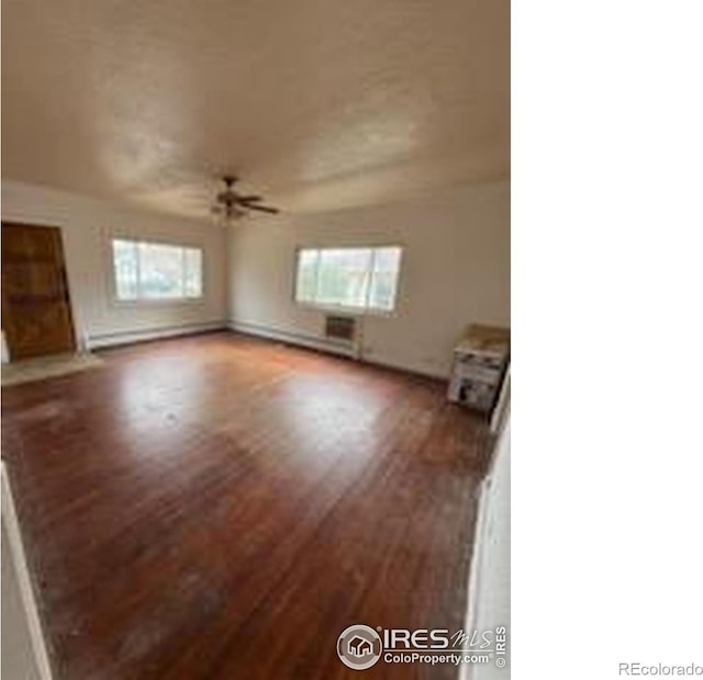 interior space with a baseboard radiator, a ceiling fan, and wood finished floors