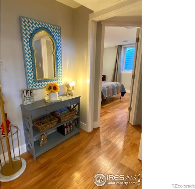 7170 Zuni St, Denver, CO 80221 - corridor featuring light wood-style flooring and baseboards