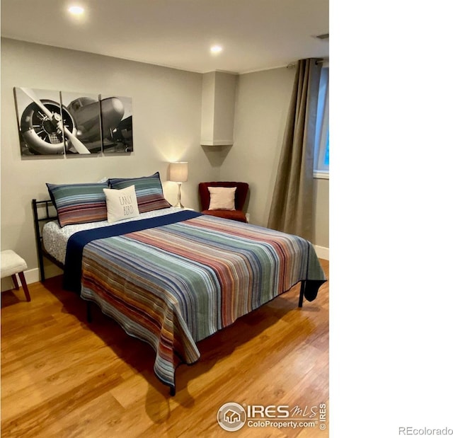 7170 Zuni St, Denver, CO 80221 - bedroom with recessed lighting, baseboards, and wood finished floors