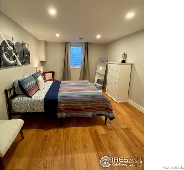 7170 Zuni St, Denver, CO 80221 - bedroom featuring light wood-type flooring, baseboards, visible vents, and recessed lighting