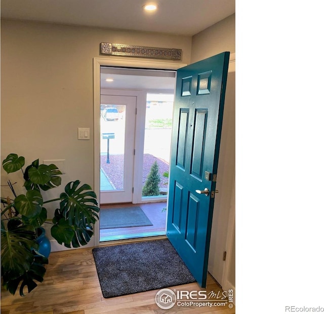 7170 Zuni St, Denver, CO 80221 - foyer with wood finished floors and recessed lighting