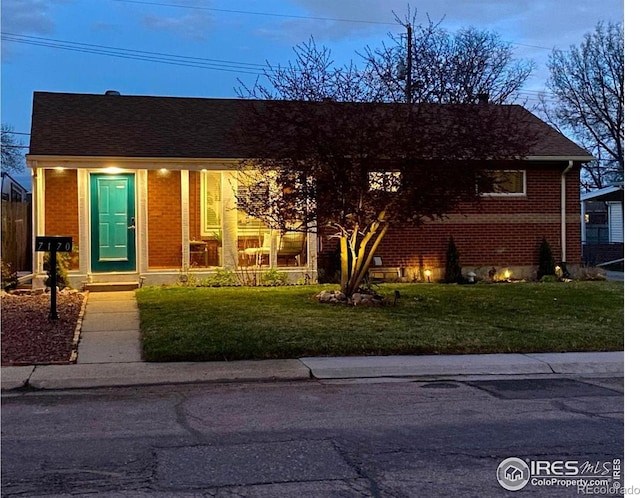 7170 Zuni St, Denver, CO 80221 - single story home with brick siding and a front lawn