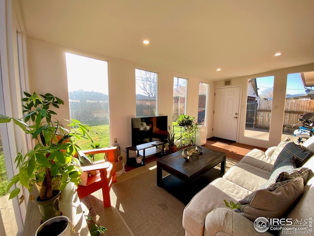 7170 Zuni St, Denver, CO 80221 - living area featuring visible vents, a wealth of natural light, and recessed lighting