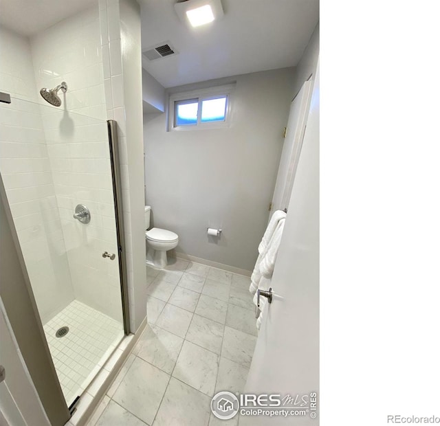 7170 Zuni St, Denver, CO 80221 - bathroom featuring visible vents, toilet, marble finish floor, a stall shower, and baseboards