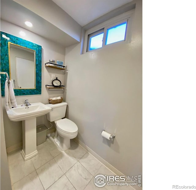 7170 Zuni St, Denver, CO 80221 - half bath with toilet and baseboards