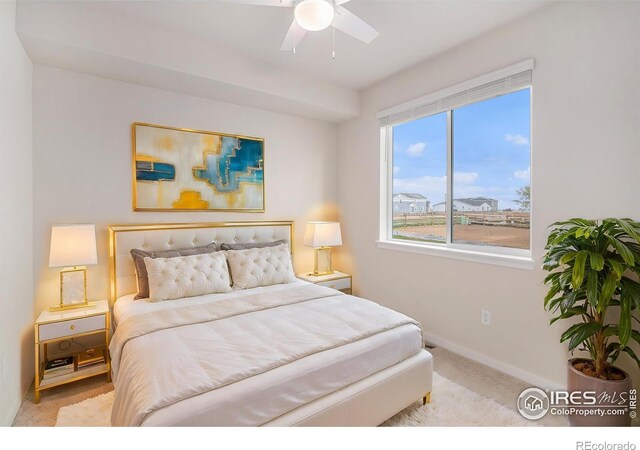 bedroom featuring carpet floors, baseboards, and a ceiling fan