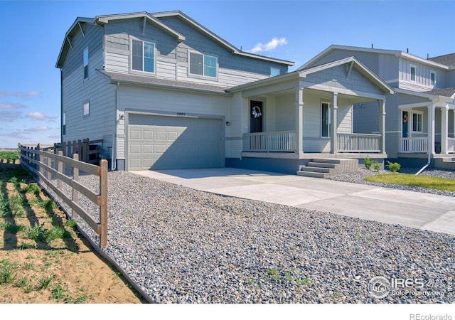 view of front facade with concrete driveway, a porch, fence, and a garage