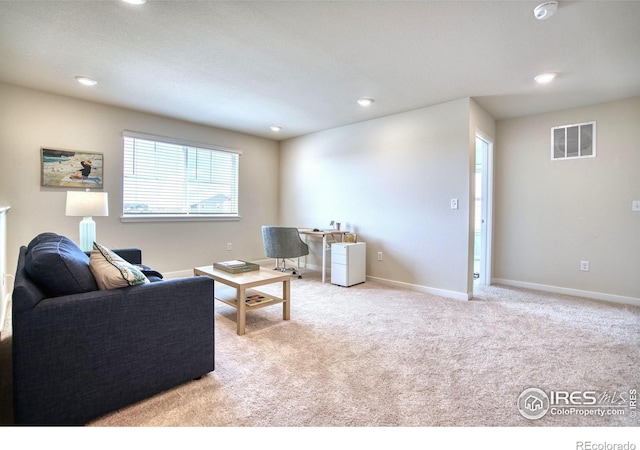 living room featuring recessed lighting, visible vents, baseboards, and carpet floors