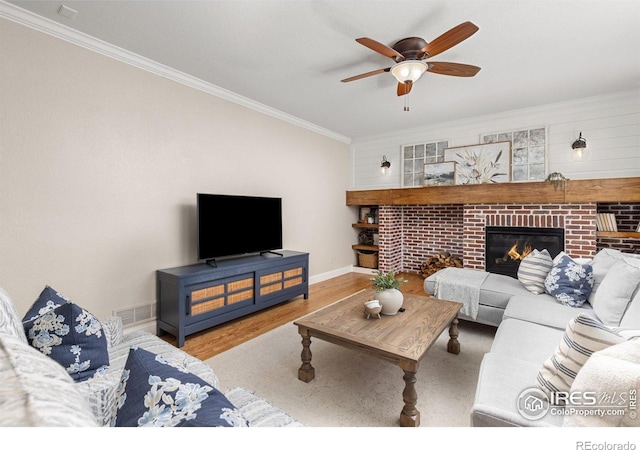 248 Muscovey Ln, Johnstown, CO 80534 - living room featuring ceiling fan, ornamental molding, visible vents, wood finished floors, and baseboards