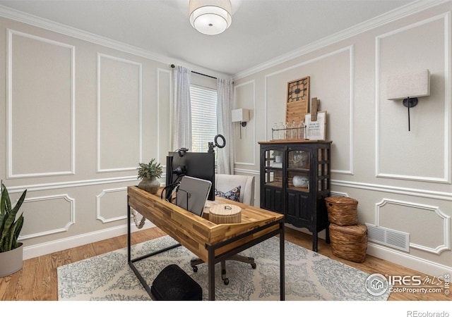 248 Muscovey Ln, Johnstown, CO 80534 - office with a decorative wall, visible vents, crown molding, and wood finished floors