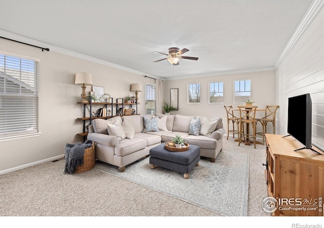 248 Muscovey Ln, Johnstown, CO 80534 - carpeted living area featuring plenty of natural light, baseboards, ornamental molding, and a ceiling fan