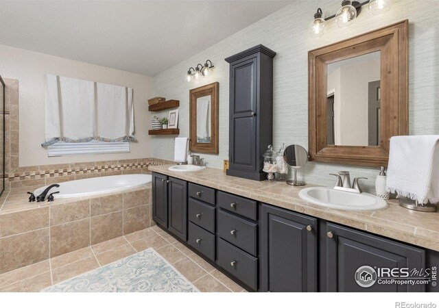 248 Muscovey Ln, Johnstown, CO 80534 - full bath featuring tile patterned floors, double vanity, a bath, and a sink