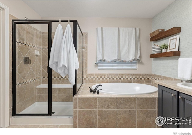 248 Muscovey Ln, Johnstown, CO 80534 - bathroom featuring vanity, a garden tub, and a stall shower