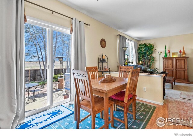 11470 Ebony St, Firestone, CO 80504 - dining space featuring wood finished floors