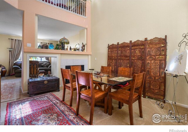 11470 Ebony St, Firestone, CO 80504 - carpeted dining space with a fireplace