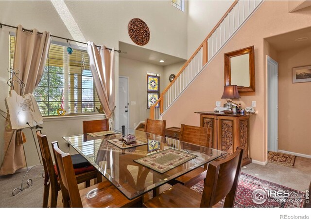 11470 Ebony St, Firestone, CO 80504 - dining area with baseboards, stairway, and carpet flooring