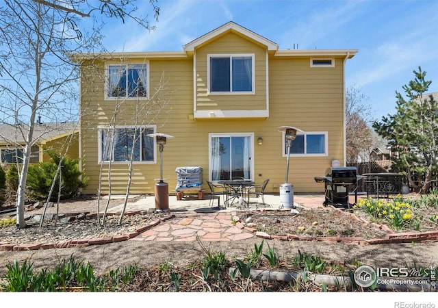 11470 Ebony St, Firestone, CO 80504 - back of house featuring a patio area and fence